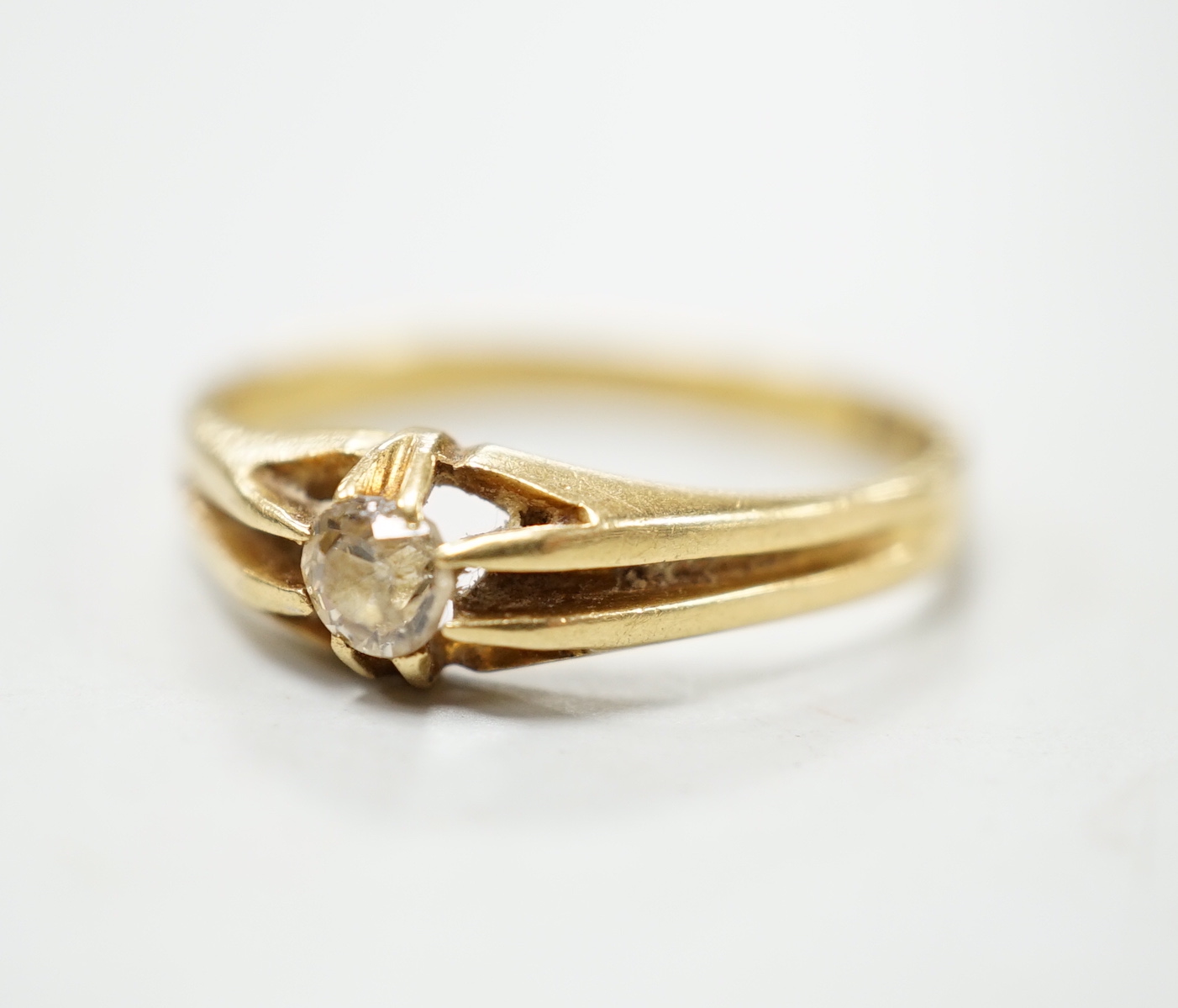 A George V 18ct gold and claw set solitaire diamond ring, size P, gross weight 3 grams.